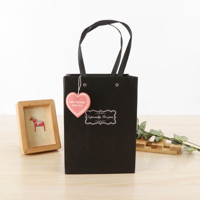 Bolsas de compras de papel de gran capacidad de venta al por menor Bolsas de mano Matt Laminado Superficie de acabado