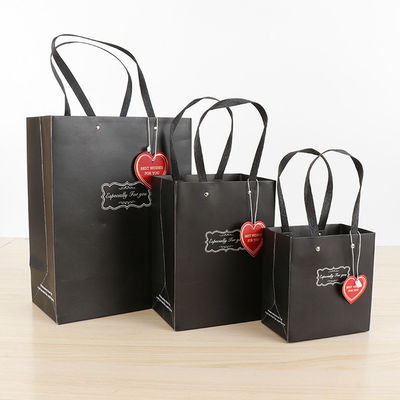 Bolsas de compras de papel de gran capacidad de venta al por menor Bolsas de mano Matt Laminado Superficie de acabado