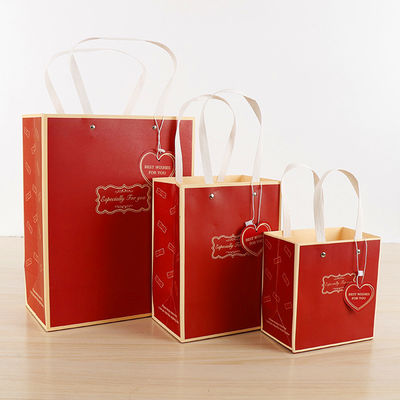 Bolsas de compras de papel de gran capacidad de venta al por menor Bolsas de mano Matt Laminado Superficie de acabado
