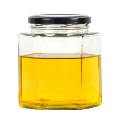 Botella de almacenamiento de vidrio transparente hexagonal de 100 ml 500 ml con tapa metálica para crema de miel